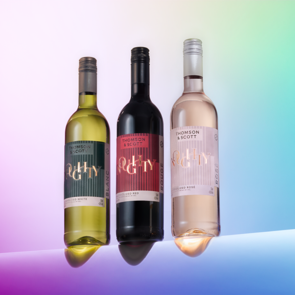 Three wine bottles from Thompson & Scott on a gradient background. Modern style labels for dealcoholized white/blanc, Red/rouge and Rosé.