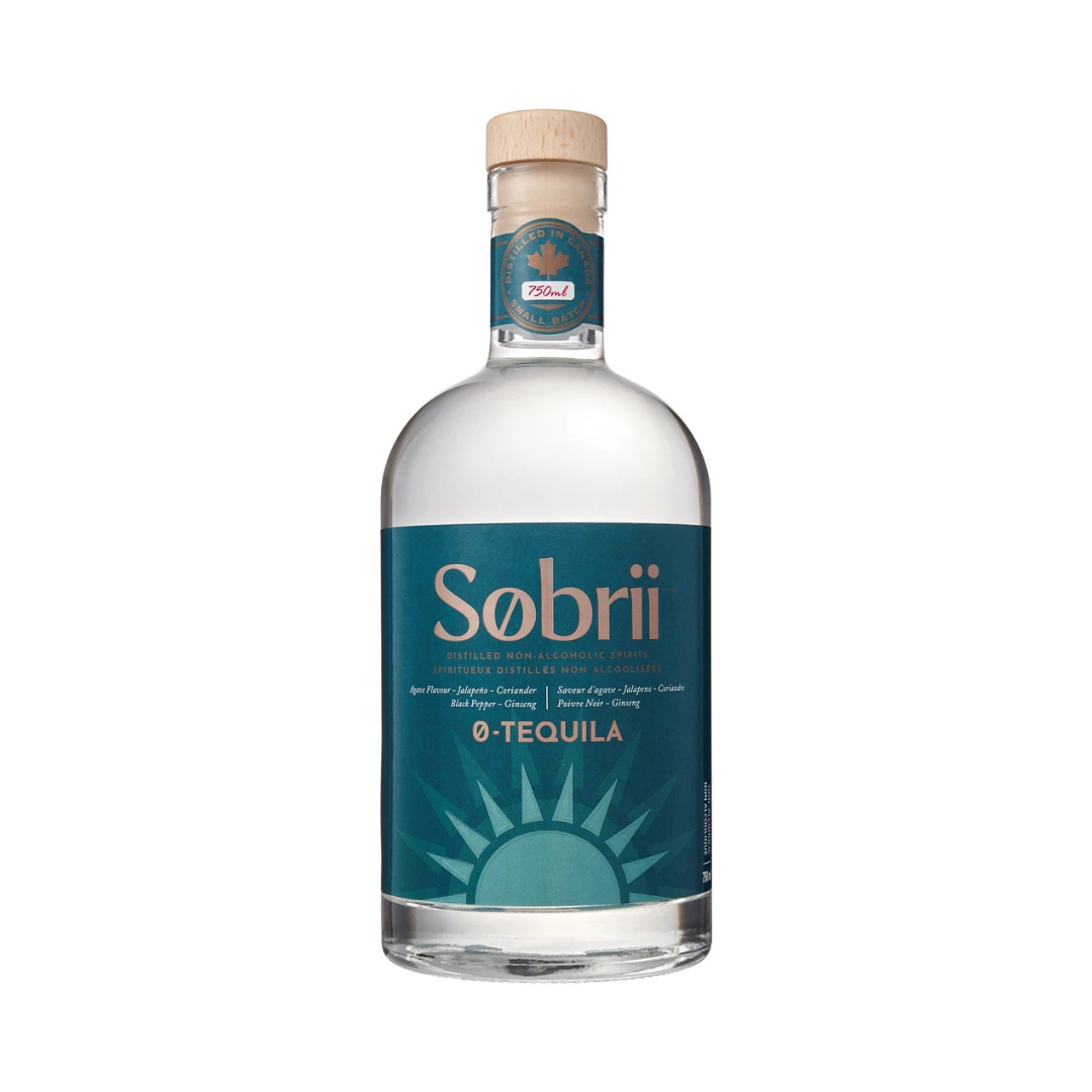 A bottle of Sobrii 0-Tequila Non-Alcoholic with a deep blue label featuring the brand name and '0-Tequila' text above a rising sun, set against a plain background.