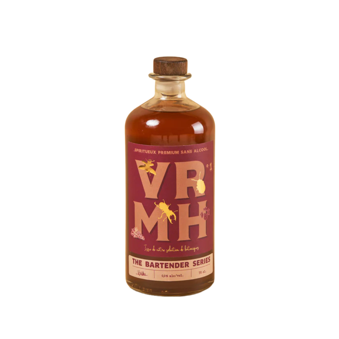 A bottle of BTR Non-Alcoholic Spirit from The Bartender Series, featuring a rich amber liquid and a stylish label with bold "VRMH" typography. The design incorporates artistic illustrations of botanicals, emphasizing its premium, handcrafted essence.