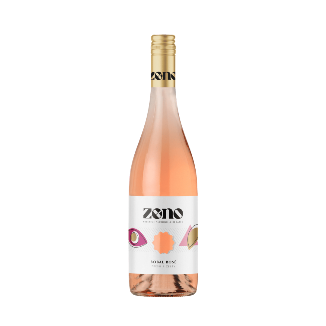 Zeno Bobal Rosé non-alcoholic wine, 750ml bottle from Spain with gold screw cap and modern white label with gold and pink geometric shapes. Fresh, zesty rosé with red fruit, peach, and citrus notes.