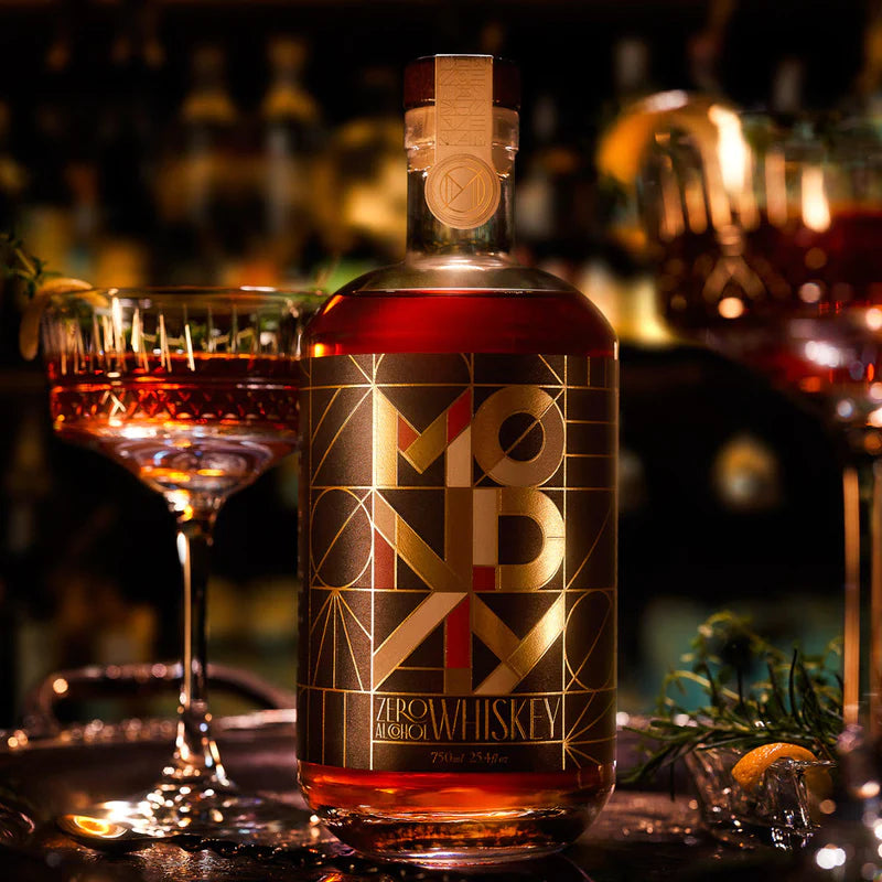 bottle of monday whisky with moody lighting and romantic candle lit background, art deco style with sexy cocktail in background