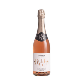 Thomson & Scott Noughty Dealcoholized Sparkling Rosé bottle. A premium alcohol-free sparkling rosé featuring a vibrant pink hue and elegant packaging for sophisticated non-alcoholic celebrations.