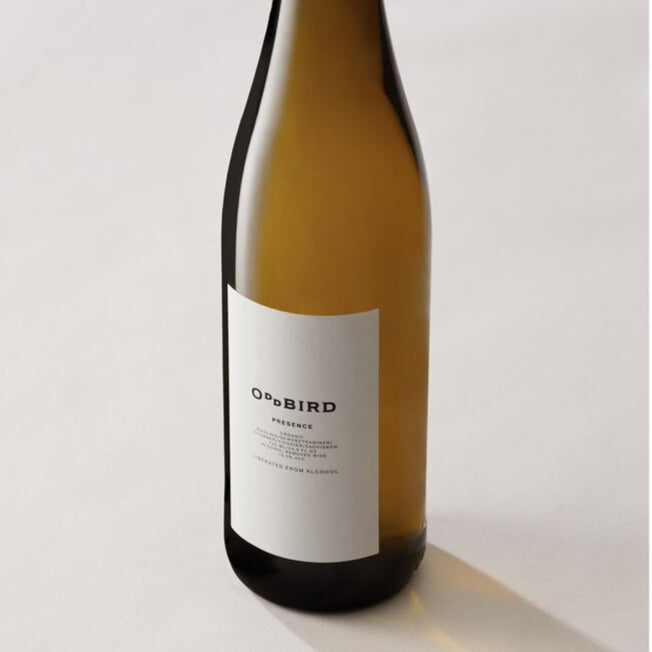 Wine bottle with a white label on a light gray background