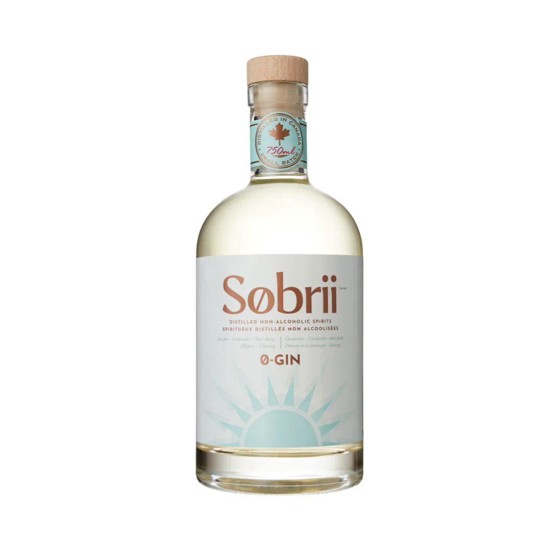 A clear bottle containing Sobrii 0-Gin non-alcoholic spirit with a label and a botanical design, a cork seal, and a branded cap.