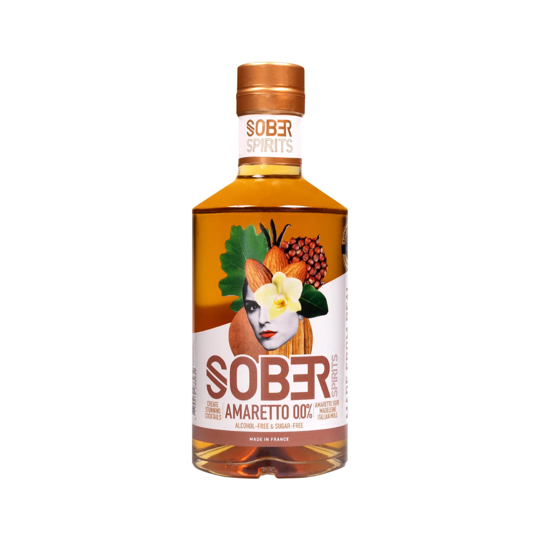 Bottle of Sober Spirits Amaretto 0.0% non-alcoholic liqueur with amber liquid, featuring a surreal label with almonds, vanilla, and cherry elements. Alcohol-free and sugar-free, made in France.