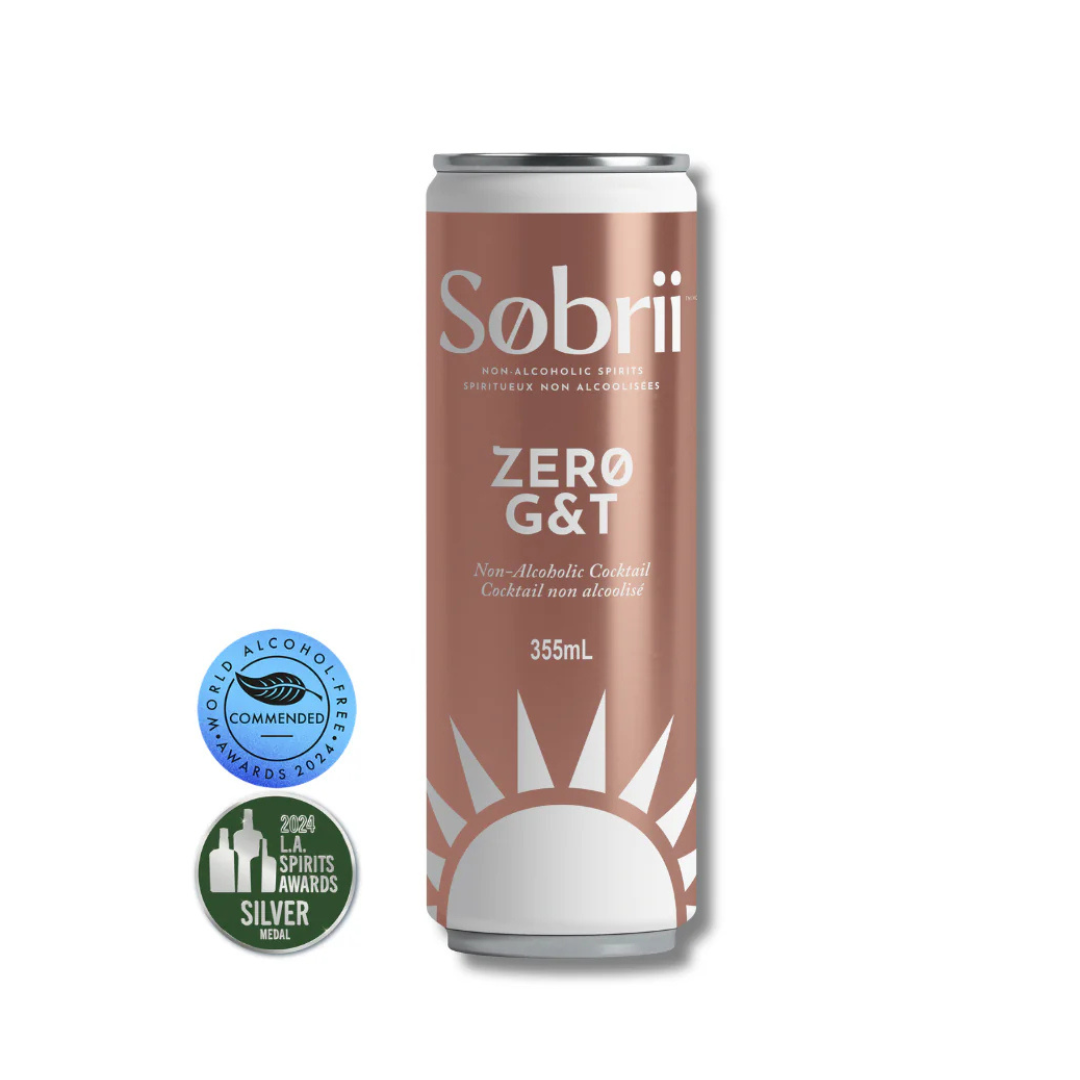 Sobrii Zero G&T non-alcoholic cocktail 355mL can with bronze and white design, featuring award badges from World Alcohol-Free Awards and L.A. Spirits Awards.